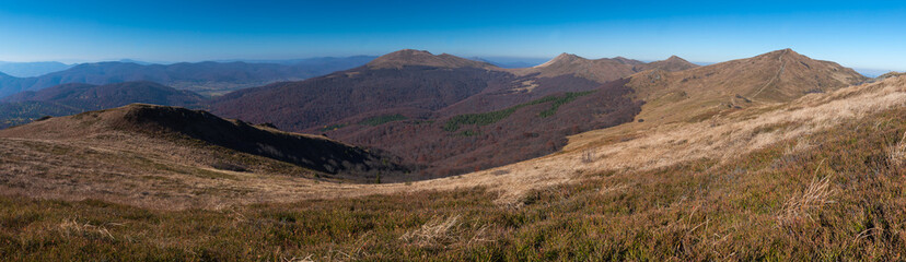 Fototapeta premium Panorama from the Rozsypaniec summit to the peaks of Tarnica, Halicz, Bukowe Berdko, Krzemien, Polonina Carynska, Kopa Bukowska, Bieszczady Mountains, Wołosate