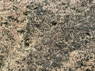 Texture of a old grungy gray concrete wall with cracks as a background or wallpaper