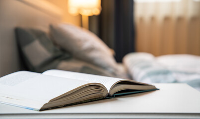 cozy bedroom detail focus on open book
