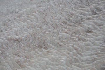 Carbonate mineral left by the flowing of thermal spring calcite-laden waters in Pamukkale