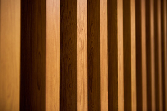 decorative wooden slats on the wall. prospect of wooden bars. Line, architecture and decoration of natural wood.