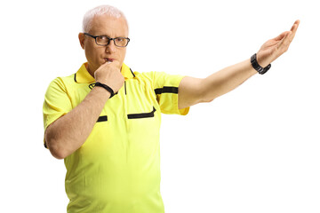 Football referee blowing a whistle and gesturing a sign
