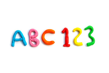 Alphabet with number made of colorful plasticine clay on white.