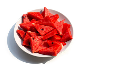 Watermelon slices in white plate on white