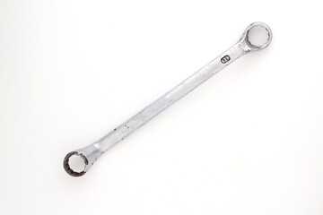 Stainless steel wrench isolated on white background. Top view.