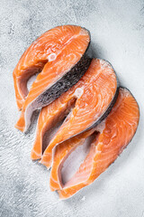 Salmon or trout steaks, raw fish prepared for cooking. White background. Top view