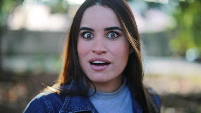 Young woman shock surprise reaction. Person reacting to shocking news