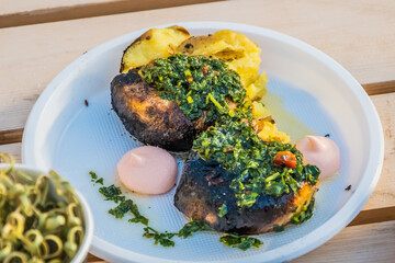 Vegetarian cuisine-hot baked potato slices