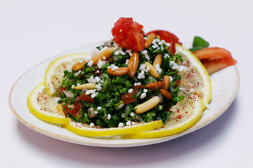 libanese, turkish, arabic food mezze, includes hummus, muhammara, moutabal, taboule and vine leaves..