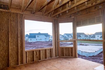 Fototapeta na wymiar Interior wood framework of new residential home under construction