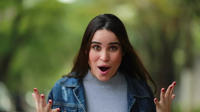 Young woman shocking reaction. Girl reacting with surprise. WOW emotion