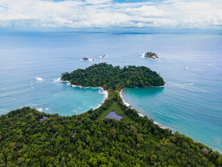 Beautiful aerial view of Manuel Antonio National Park and its magnificent beach in Quepos Costa...