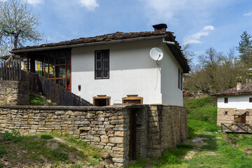 Typical street and old houses at historical village of Bozhentsi, Bulgaria