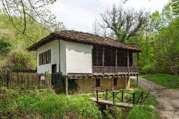 Fototapeta na wymiar Typical street and old houses at historical village of Bozhentsi, Bulgaria