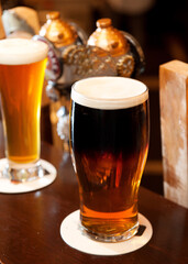 Pints of ale and lager on the bar top of an Irish pub.  Whistler BC, Canada.