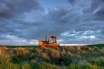 Fototapeta premium tractor on the field