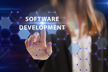 Business, Technology, Internet and network concept. Young businessman working on a virtual screen of the future and sees the inscription: Software development