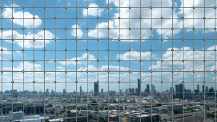 Fototapeta na wymiar metal net of grids isolated skyscape background - industrial pattern on photography image.
