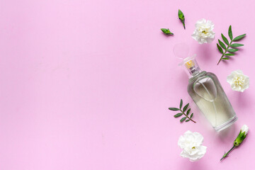 Floral flat lay with perfume bottle, top view