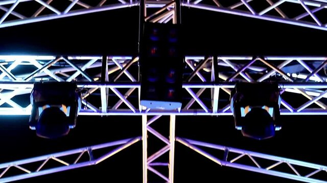 Concert stage with fast moving camera, flashing spot lights, ready for musical presentation. Professional JIB camera recording during the concert. Spectacular designStage ready for musical presentatio