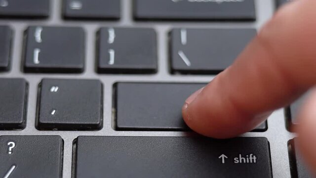 Enter button long pressing a lot of times on keyboard, laptop keyboard close up