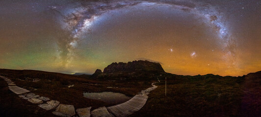 Milky Way panorama over Cradle Mountain Summit and the Overland Track with crazy red airglow in the sky