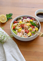 Fresh mango shrimp salad on the table