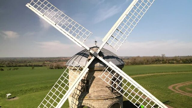 Chesterton white stone cylinder domed tower Windmill aerial view pull away revealing rural countryside