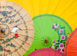Colorful paper umbrella background, design Chinese and Thai style paint umbrella