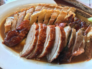 Yummy roasted duck and crispy pork dish