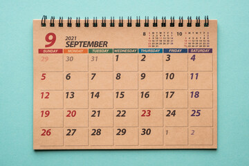 June 2021 desk calendar on green background