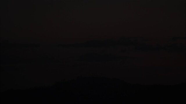 far away mountain in the last moment of the day, the cloud shaping on top of the mountain before the night cover everything
