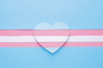 Flag of transgender in shape of heart on color background
