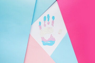 Palm print on color background. Concept of transgender