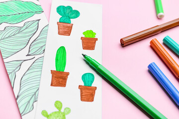 Cute bookmarks with markers on color background