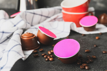 Coffee capsules on dark background