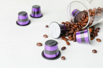 Fototapeta na wymiar Coffee capsules on white table