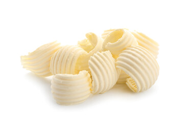 Curls of fresh butter on white background