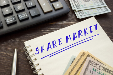  SHARE MARKET inscription on the piece of paper.
