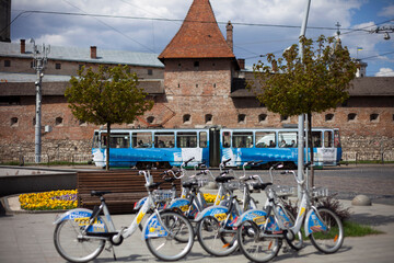 Bicycles, tram on the background of the Bernardine monastery in the old city of Lviv