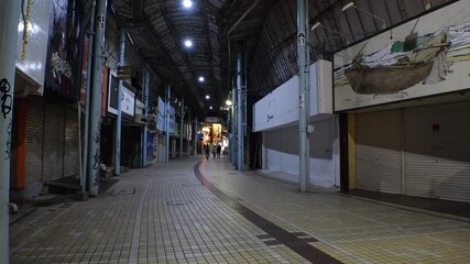 NAHA, OKINAWA, JAPAN - 6 MAY 2021 : View around central downtown area Kokusaidori street. Street is normally busy, but lightly populated due to concerns over Coronavirus(COVID-19). State of emergency.