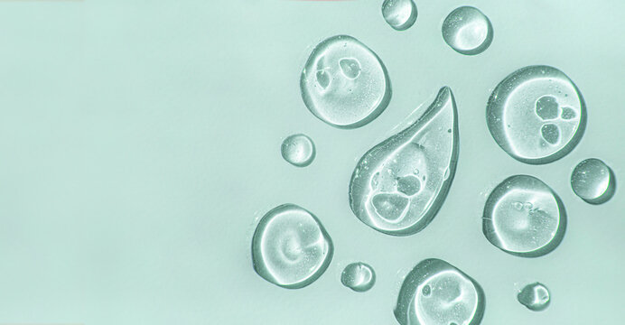 a Aloe vera drops of liquid gel serum , texture micro bubble on green background, beauty concept, horizontal banner.
