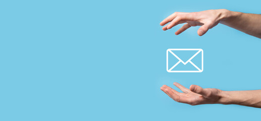 Male hand holding letter icon,email icons .Contact us by newsletter email and protect your personal...