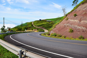 Beautiful long road on the mountain summer day and bright blue sky
