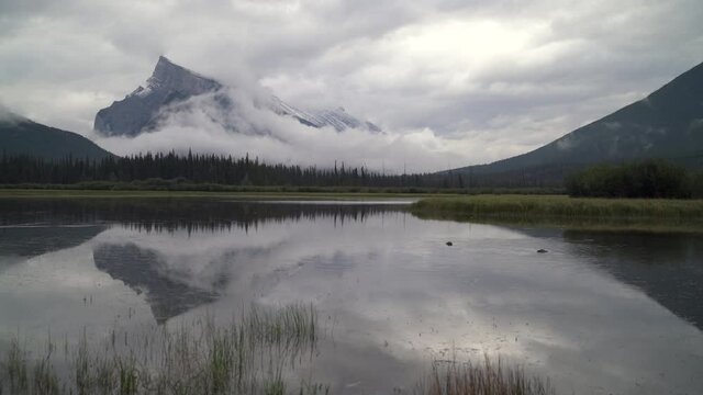 Vermilion Lakes Misty Reflection Alberta 4K UHD. Vermilion Lakes reflection of fresh snow on Mount Rundle. Alberta, Canada. 4K UHD.
