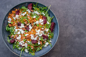 healthy home made couscous salad with sweet potato, beetroot and feta cheese