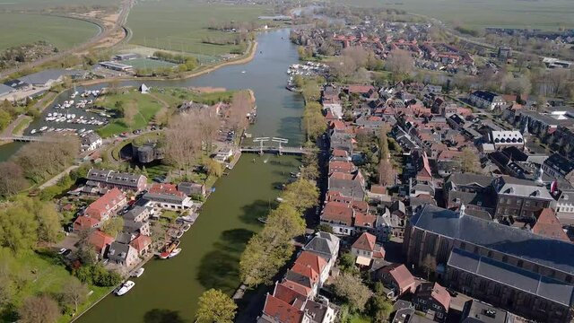 Weesp small city in North holland, The Netherlands, city view along the water aerial drone footage.