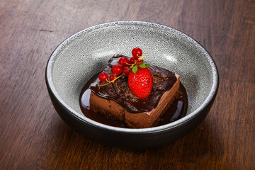 Sweet chocolate cake served strawberry