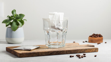 Drip coffee bag in a mug. Trends in brewing coffee at home.