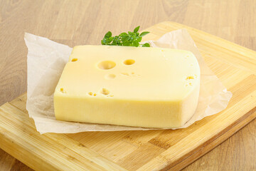 Maasdam cheese over the board